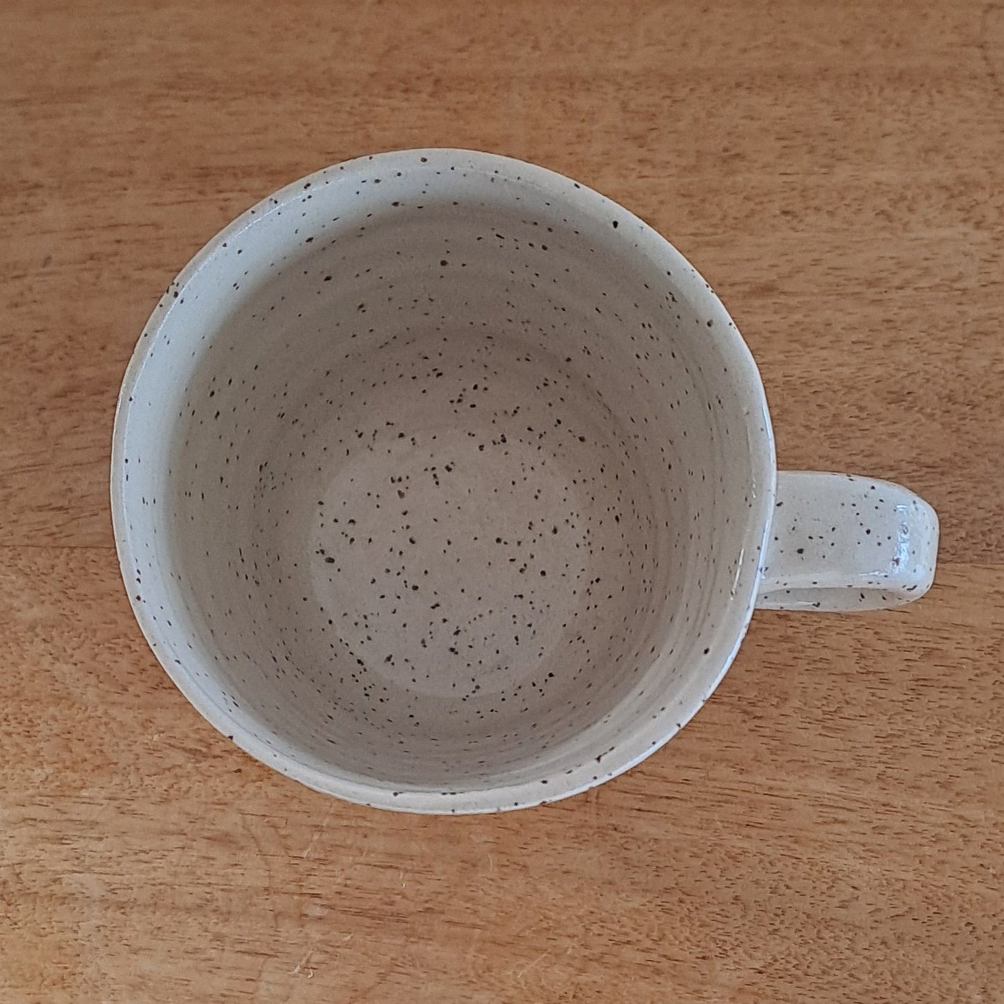 Ceramic mug on a wooden surface