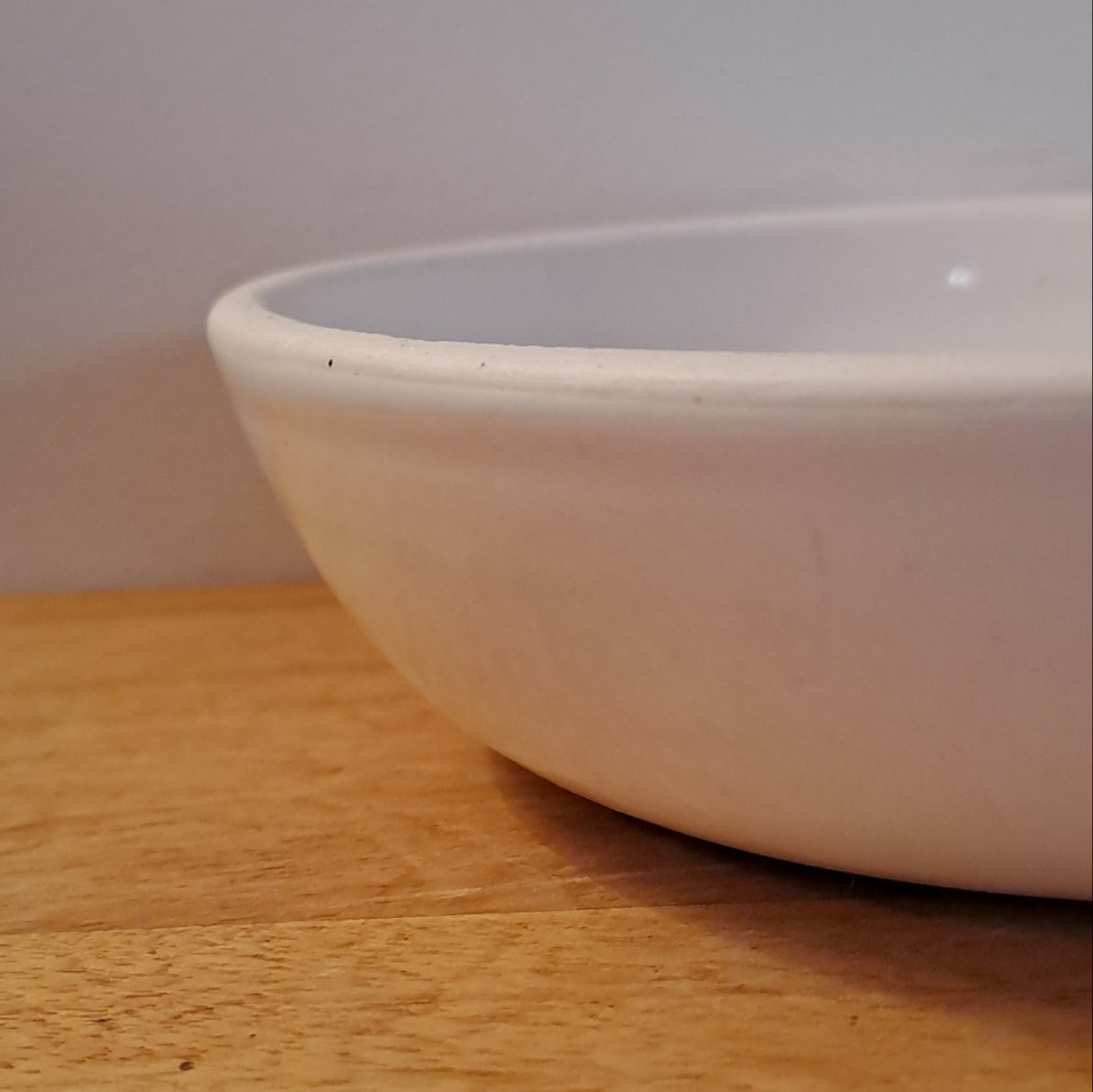 bowl is glazed in soft white