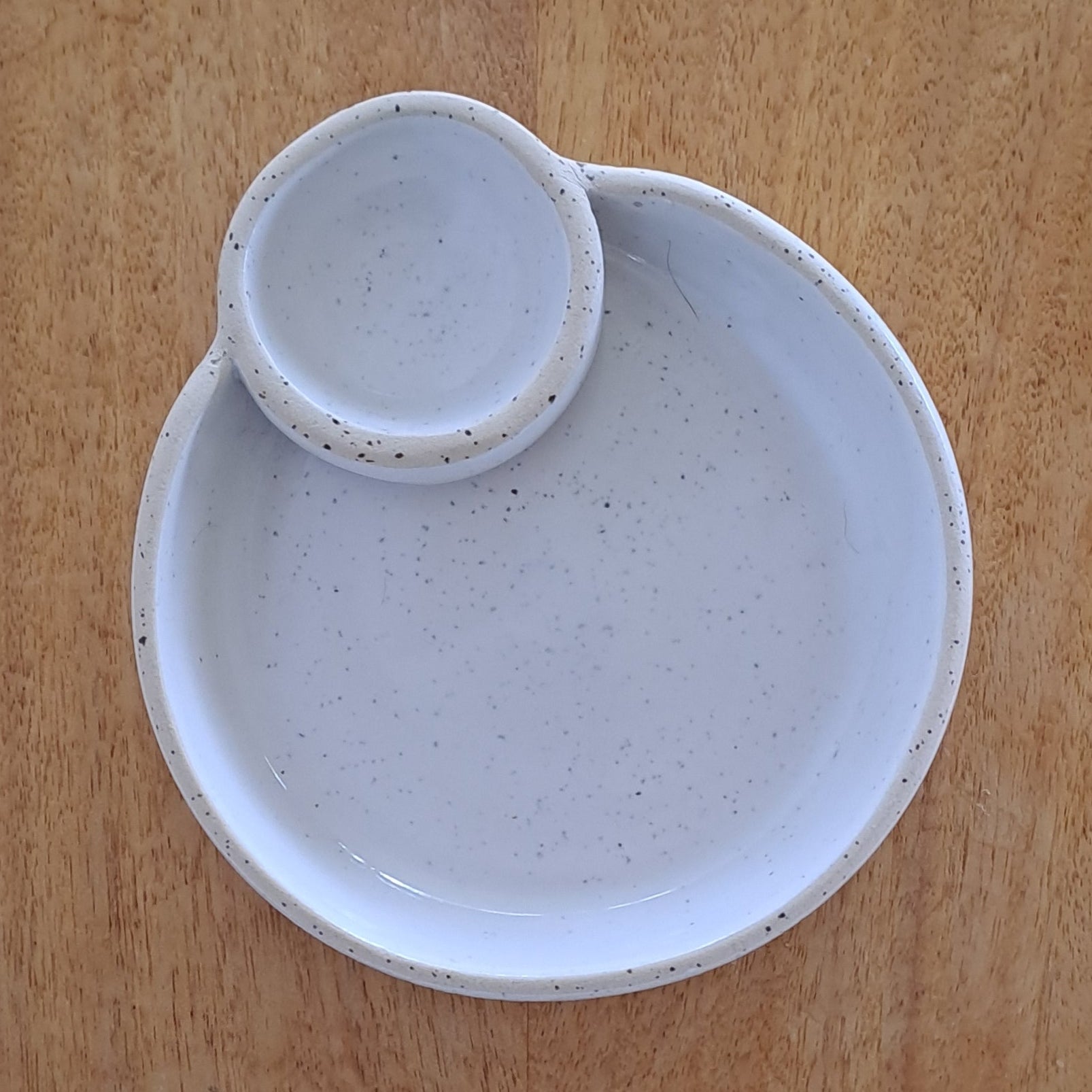 Two ceramic bowls on a wooden surface