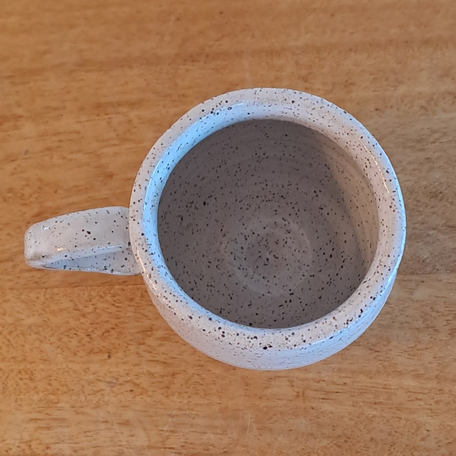 Ceramic mug on a wooden surface