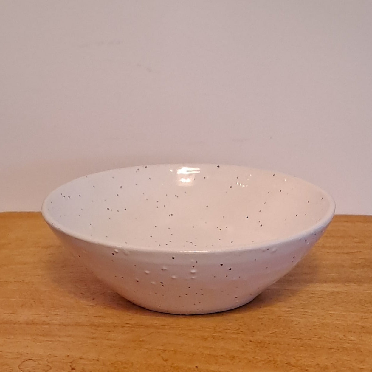  bowl is glazed in soft white with a gentle speckle