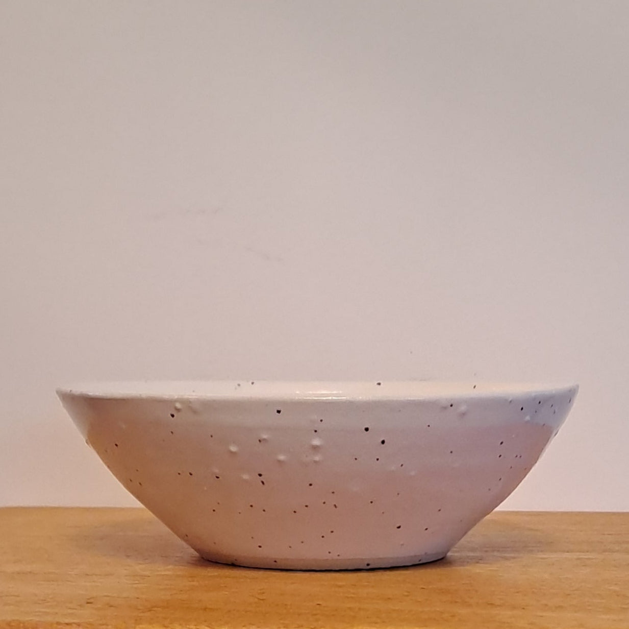  bowl is glazed in soft white with a gentle speckle