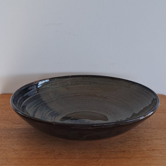everyday bowl is crafted from speckled stoneware and finished with a tenmoku glaze