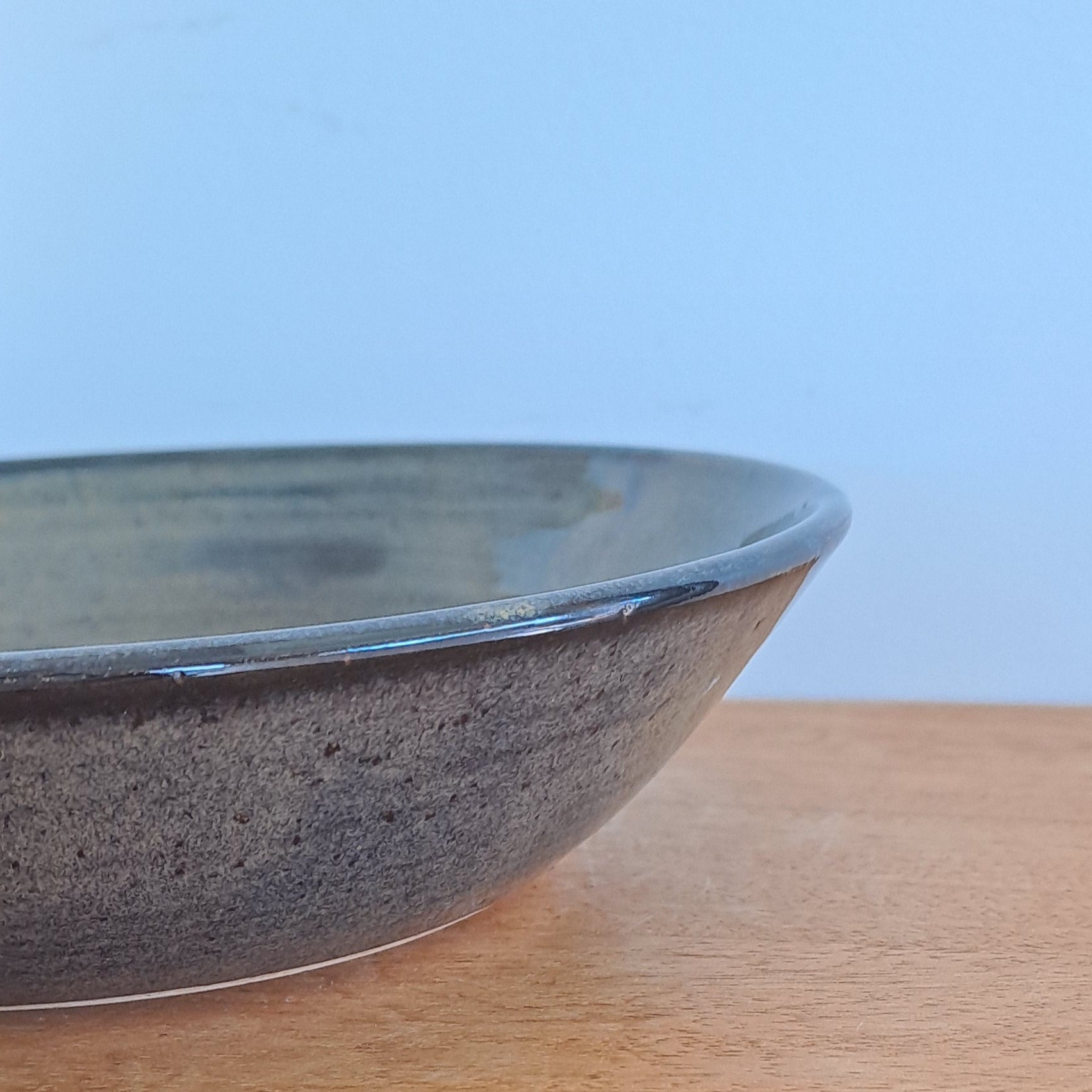 everyday bowl is crafted from speckled stoneware and finished with a tenmoku glaze