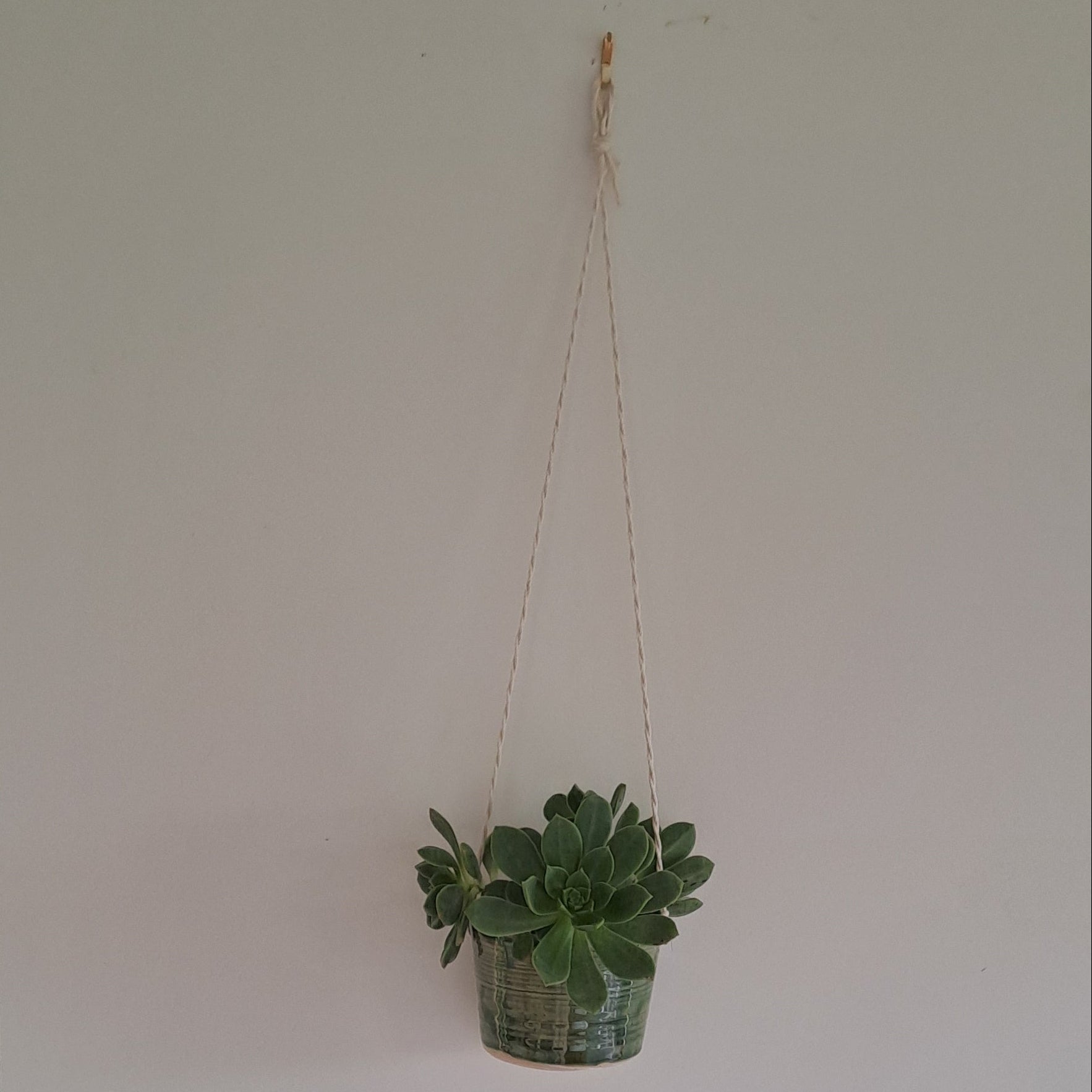 Small speckled stoneware ceramic planter with jade glaze