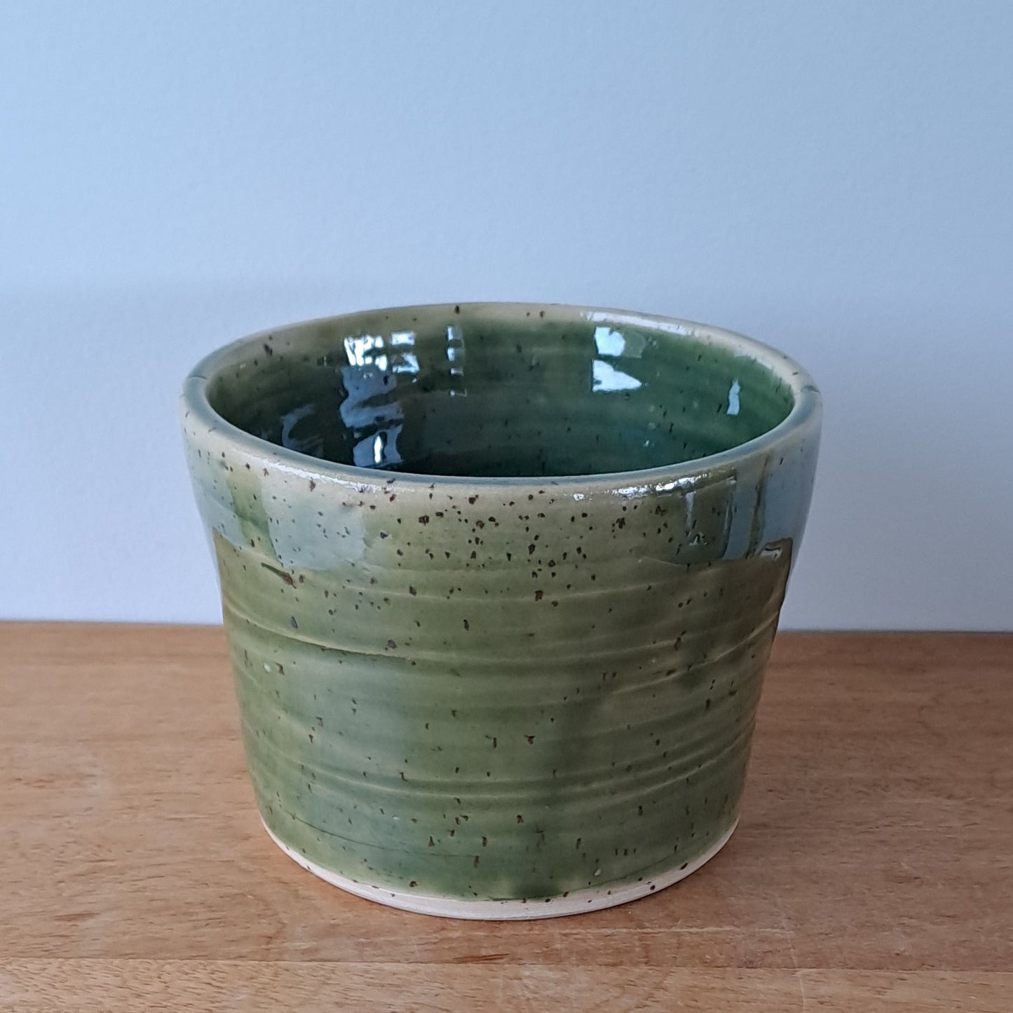 Small speckled stoneware ceramic planter with jade glaze