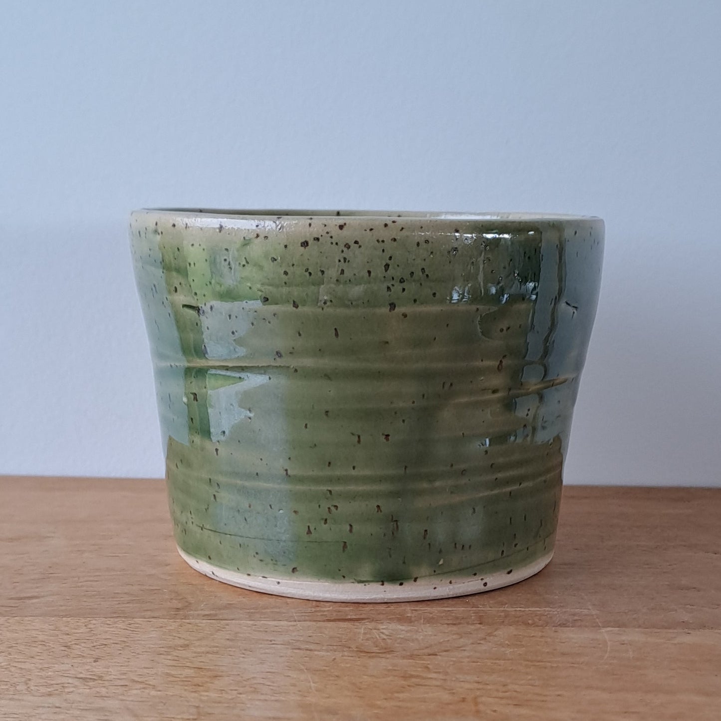 Small speckled stoneware ceramic planter with jade glaze
