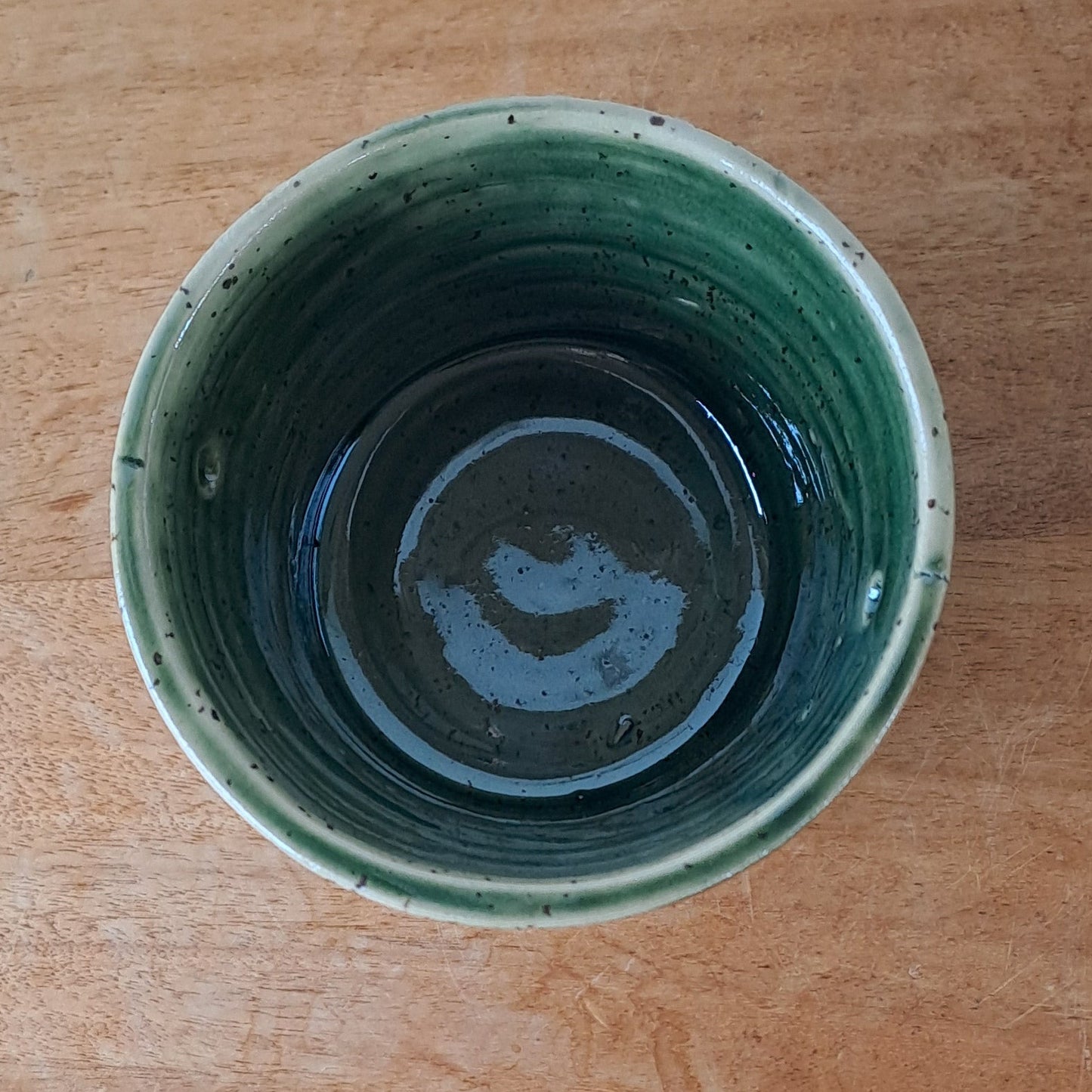 Small speckled stoneware ceramic planter with jade glaze