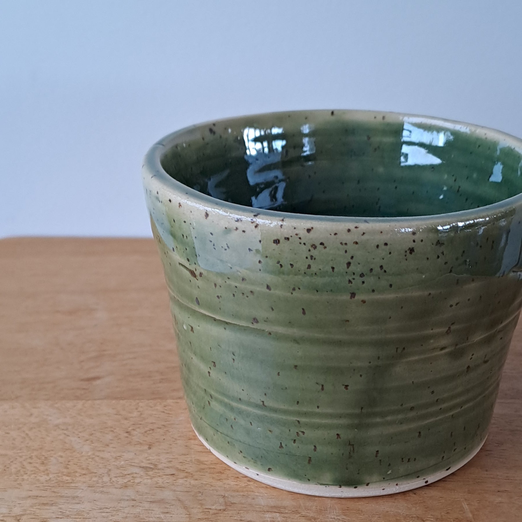 Small speckled stoneware ceramic planter with jade glaze