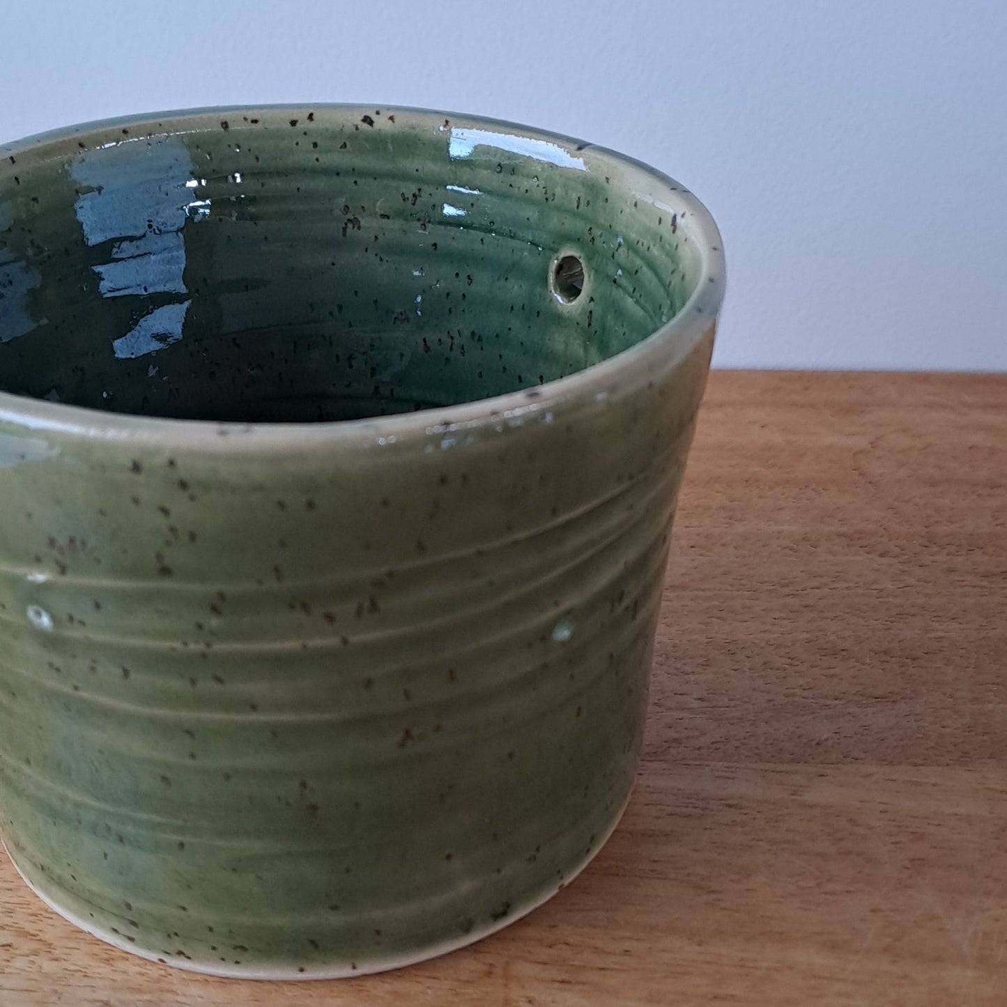 Small speckled stoneware ceramic planter with jade glaze
