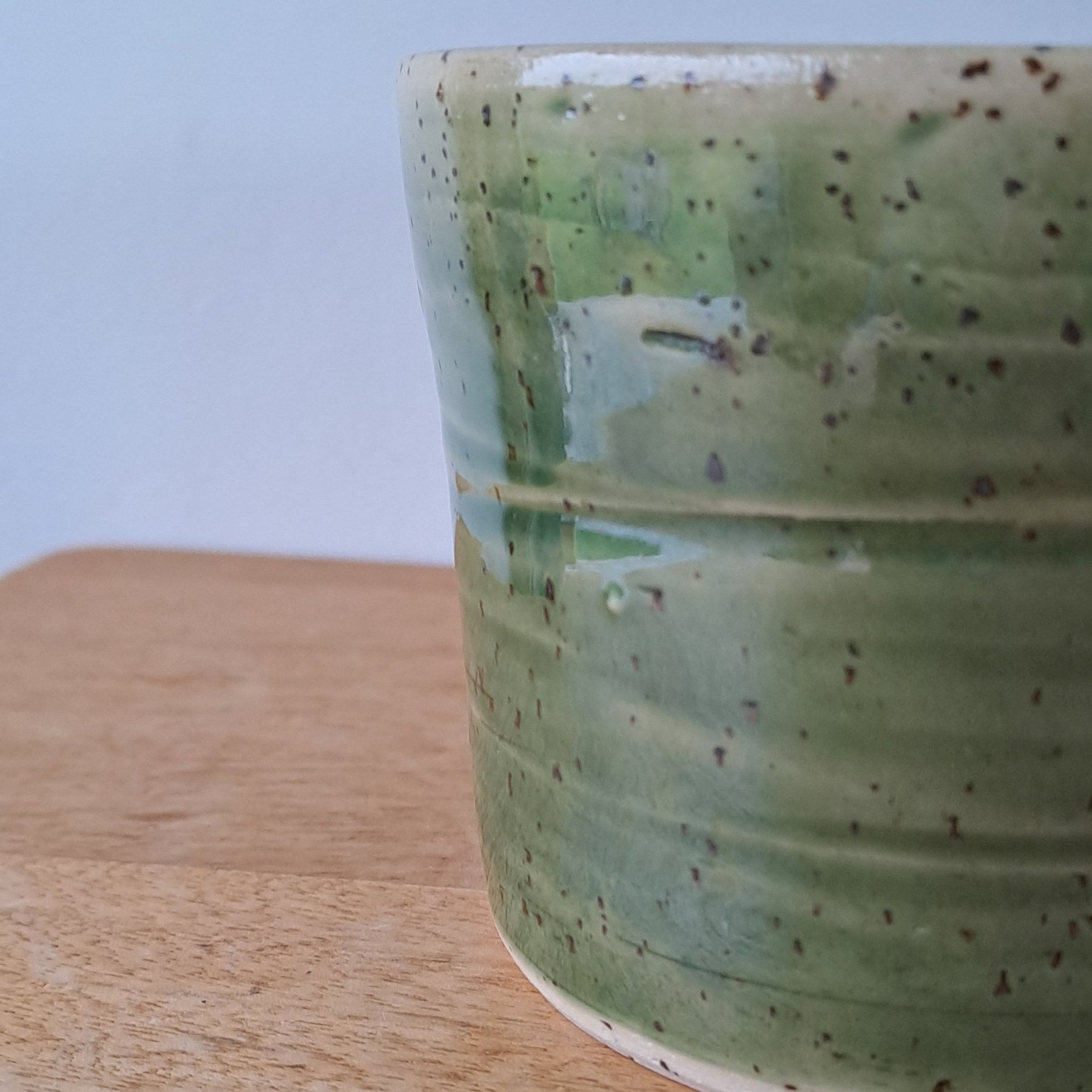 Small speckled stoneware ceramic planter with jade glaze